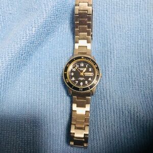 Silver and Black Watch with Gold Accents